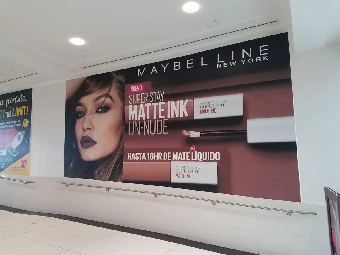 Maybelline advertisement in a shopping mall.